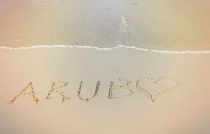 Breaker Prints: Aruba, Aruba written on sand at Juanita Beach