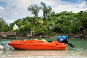 Boat Prints: Bermuda, Orange motor boat moored on beach