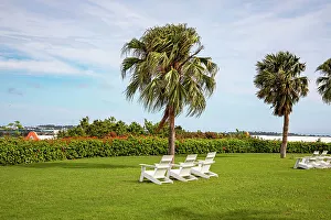 Island Prints: Bermuda, Outdoor chairs on green lawn at Grotto Bay Beach Resort & Spa