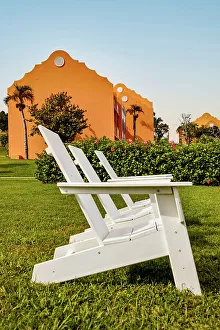 Bermuda, Outdoor chairs on green lawn at Grotto Bay Beach Resort & Spa