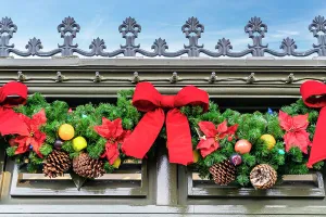 Christmastide Prints: Christmas decoration of red bows and pine cones