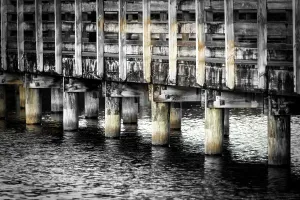 Walk Way Prints: Close up of beams underneath a wooden boardwalk