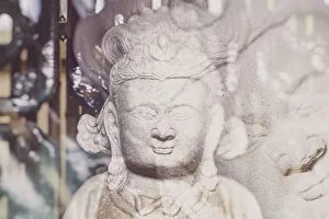 Chinese Prints: Closeup of deity statue