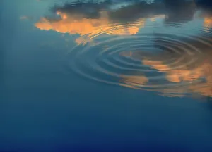 Light Prints: Clouds reflecting over water with concentric ripples