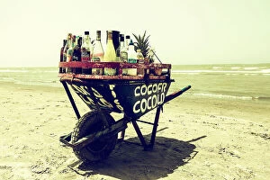 Images Dated 8th December 2023: Colombia, Cartagena, Mobile bar in wheelbarrow on beach