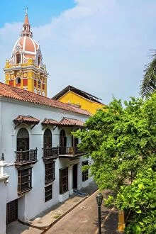 Images Dated 4th December 2023: Colombia, Cartagena, typical colonial facade, with Cathedral dome in back