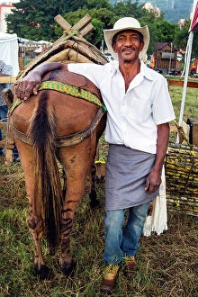 Images Dated 21st July 2019: Colombia, Medellin, Countryman Posing Next to His Horse