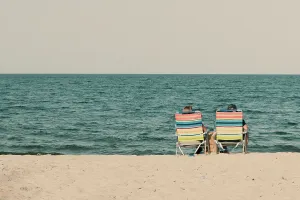 Cool Prints: Couple at the beach sitting on beach chairs