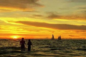 County Prints: Florida, Clearwater, sailing ship on the horizon with golden sky