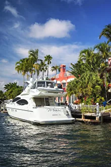 Vertical Prints: Florida, Fort Lauderdale, upscale home with yacht along the Intracoastal waterway