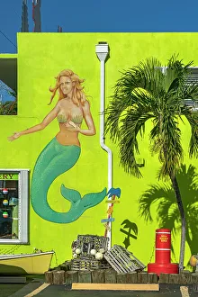 Florida, The Keys, Islamorada, mermaid mural near palm tree