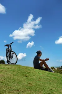 Sunny Prints: Florida, Miami Beach, South Pointe Beach Park, biker taking a break