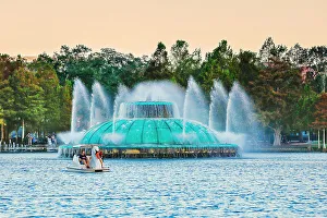 Orlando Prints: Florida, Orlando, Lake Eola Park, Fountain and Swan paddle boat
