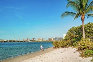 Island Prints: Florida, Palm Beach County, Peanut Island, woman walking on the beach
