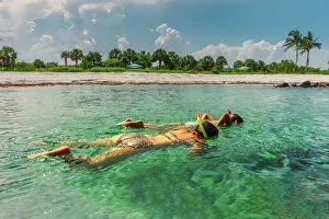 Images Dated 23rd February 2023: Florida, Peanut Island, girls snorkeling in crystal clear water
