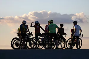 Blue Hour Prints: Group of cyclists silhouetted at sunset