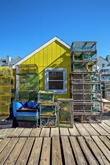 Maine, Portland, Colorful shack and lobster traps at the Widgery wharf