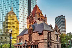 Massachusetts, Boston, Trinity Church and Berkeley Building reelecting on modern building on Boylston Street and Clarendon Street