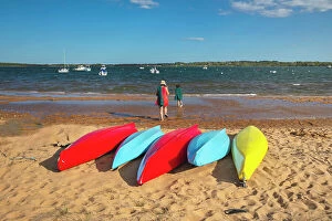 Images Dated 9th June 2020: Massachusetts, Martha's Vineyard, Colorful Kayaks laying at Menemsha Pond Beach