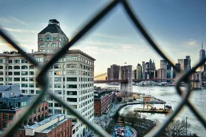 Fenced Prints: New York City, Brooklyn, View of Dumbo with Clocktower Building and Brooklyn Bridge