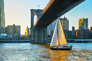 Light Prints: New York City, Lower Manhattan with Sailboat passing under Brooklyn Bridge