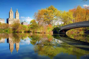 New York City, Manhattan, Central Park, View across The Lake towards San Remo Building, Bow Bridge