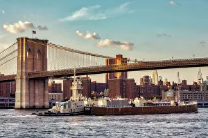 East River Prints: New York City, views of Manhattan through Brooklyn Bridge, barge under bridge
