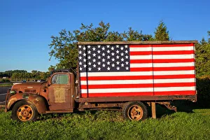 Spring Prints: New York, Long Island, Peconic, rusty truck with American flag on side of road