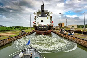 Boat Prints: Panama, Panama City, Panama Canal, cargo ship with mule locomotives guiding passage