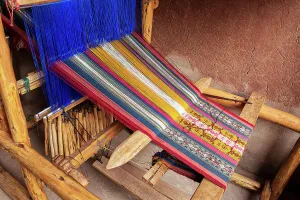 Peru, Sacred valley, detail of looming machine processing alpaca wool