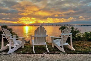 Rhode Island, Newport, adirondack chairs facing Claiborne Pell Bridge over Narragansett Bay