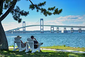Claiborne Prints: Rhode Island, Newport, People relaxing on Goat Island with view of Claiborne Pell Bridge