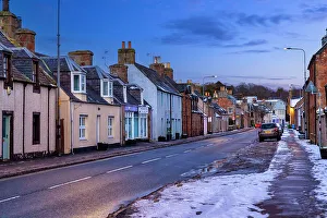 Winter Prints: Scotland, Highland, Bonar Bridge, typical village scene with row of homes and restaurant