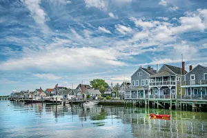 USA, Nantucket, Massachusetts, New England, shore houses and boats moored on a dock