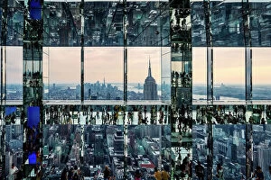 Images Dated 15th July 2022: USA, New York City, Manhattan, mirrored view of people walking on glass floor in Summit building