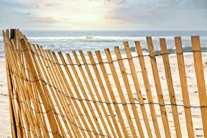 Fenced Prints: Wooden slat fence on beach
